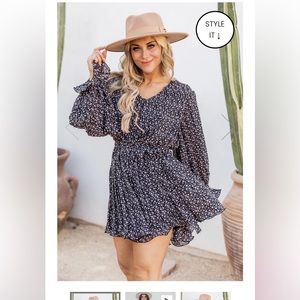 Pink Lily PRETTY ON POINT BLACK FLORAL PLEATED ROMPER- L